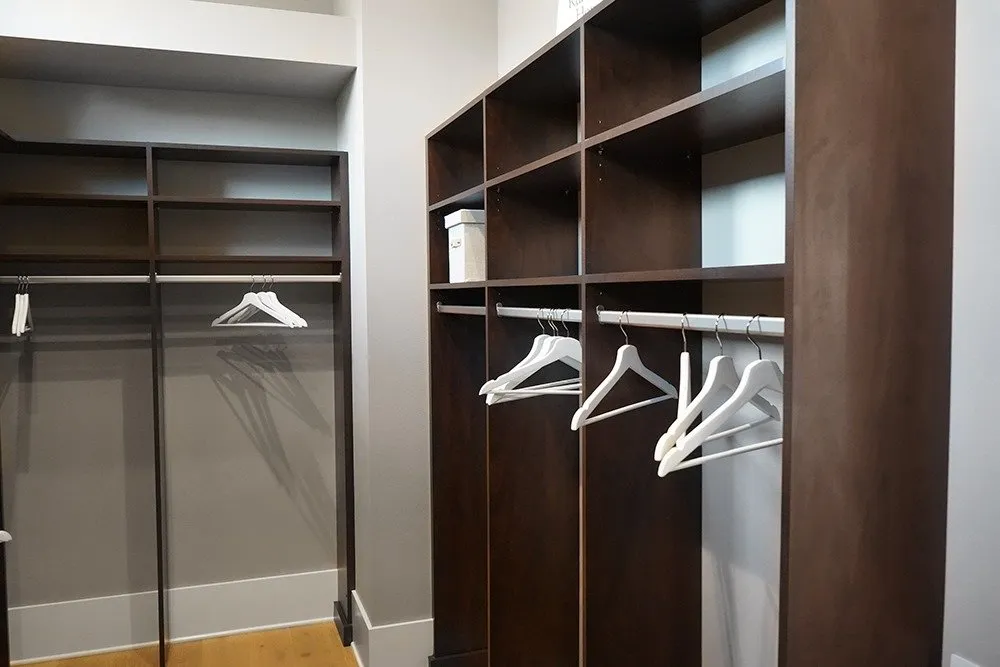 A custom walk-in pantry with pull-out shelving and adjustable storage