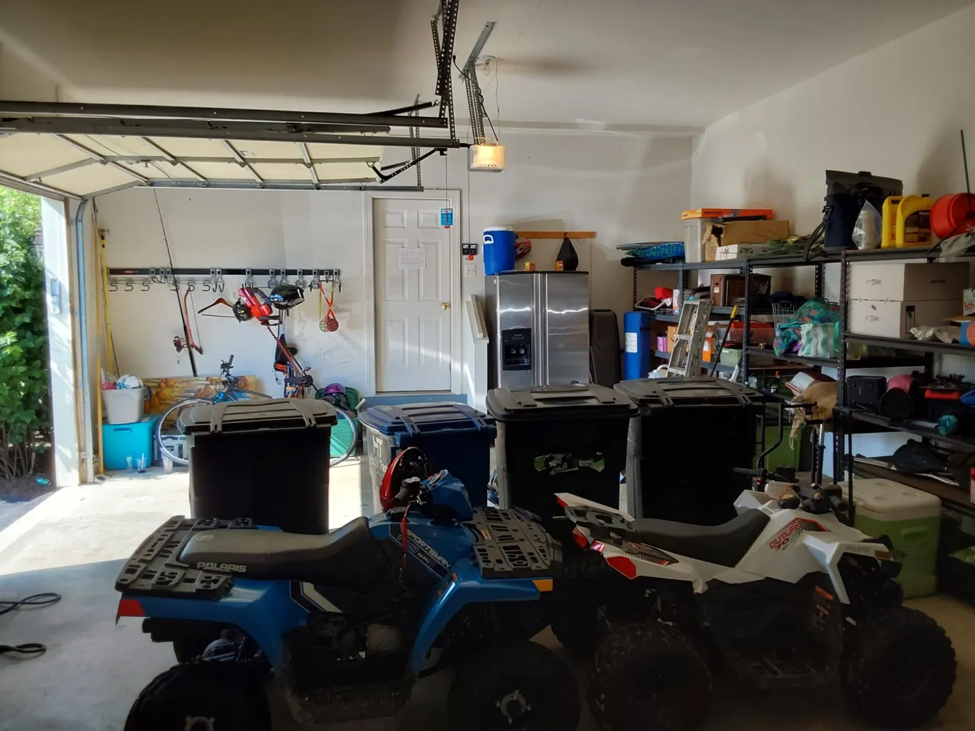 Cluttered garage before a SpaceCraft storage system